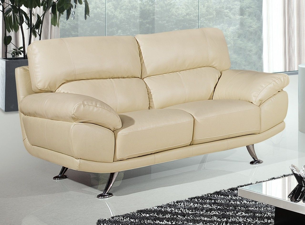 cream colored leather sofa with grey walls